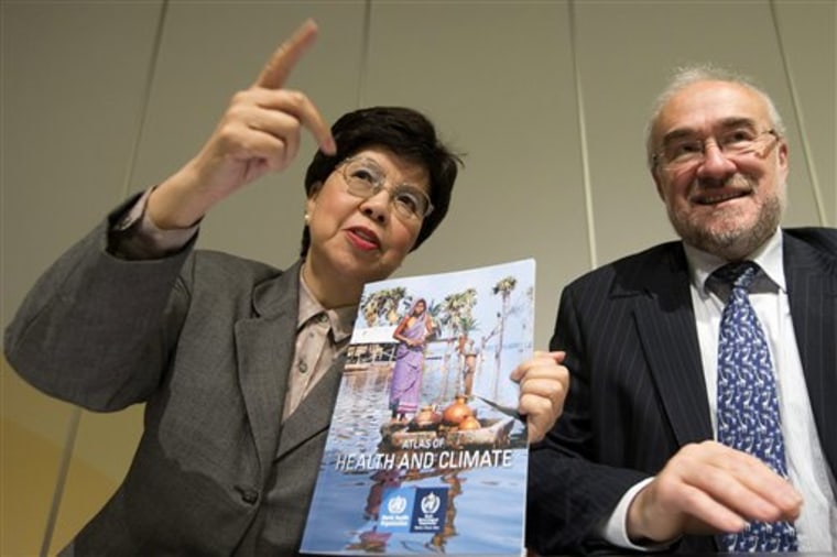 Director General of the World Health Organization (WHO) Dr. Margaret Chan, left, and Secretary-General of the World Meteorological Organization (WMO) Michel Jarraud pose for the media with the Atlas Of Health And Climate, a manual which provides a practical guide to \"climate-sensitive diseases\" that decision-makers and leaders can use as a tool for prevention, during a presentation for the media at the International Conference Center in Geneva, Switzerland, Monday, Oct.  29, 2012. (AP Photo/Keystone/Salvatore Di Nolfi)